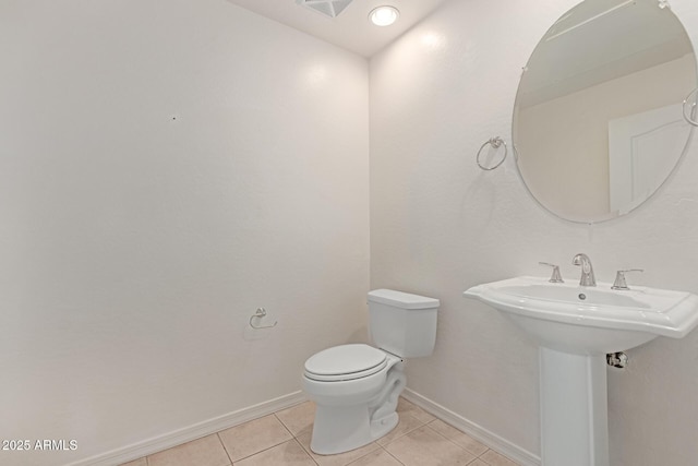 16 W Encanto Blvd Unit 26, Phoenix, AZ 85003 - half bath featuring tile patterned flooring, toilet, baseboards, and a sink