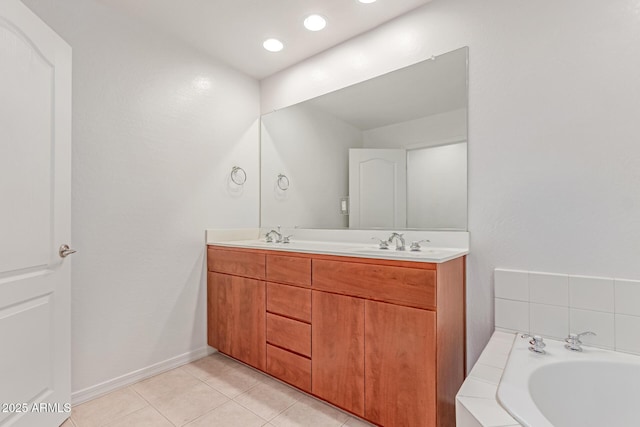 16 W Encanto Blvd Unit 26, Phoenix, AZ 85003 - bathroom with double vanity, a bath, tile patterned floors, and baseboards