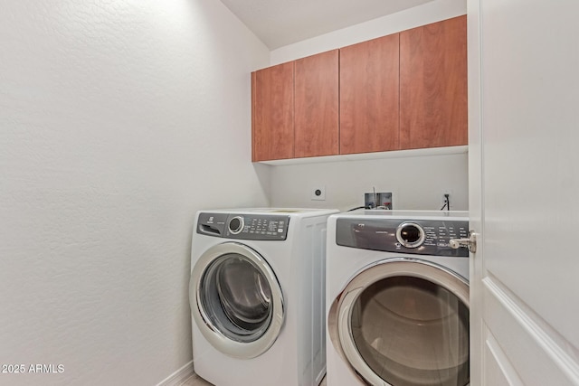 16 W Encanto Blvd Unit 26, Phoenix, AZ 85003 - washroom with cabinet space, washer and dryer, baseboards, and a textured wall