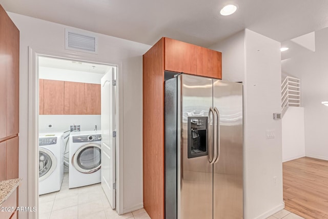 16 W Encanto Blvd Unit 26, Phoenix, AZ 85003 - washroom featuring independent washer and dryer, cabinet space, light tile patterned floors, baseboards, and recessed lighting