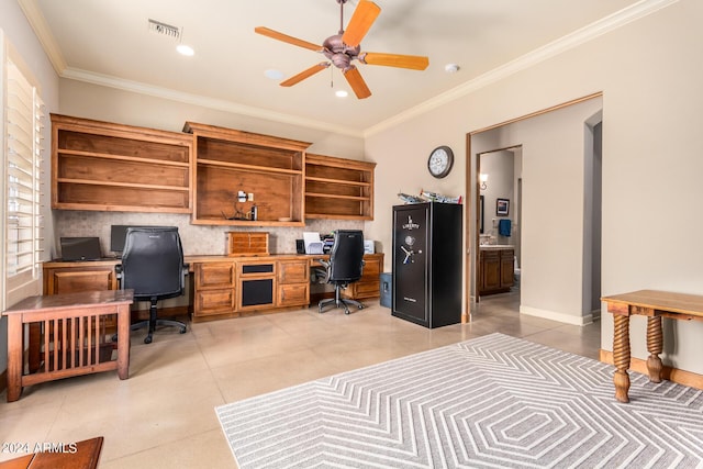 office with ceiling fan, ornamental molding, and built in desk