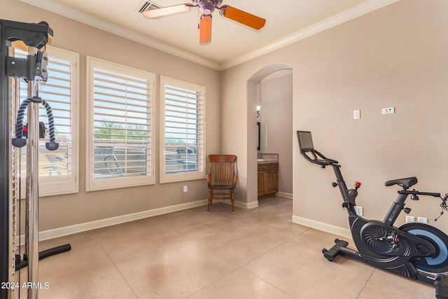 exercise area with crown molding and ceiling fan