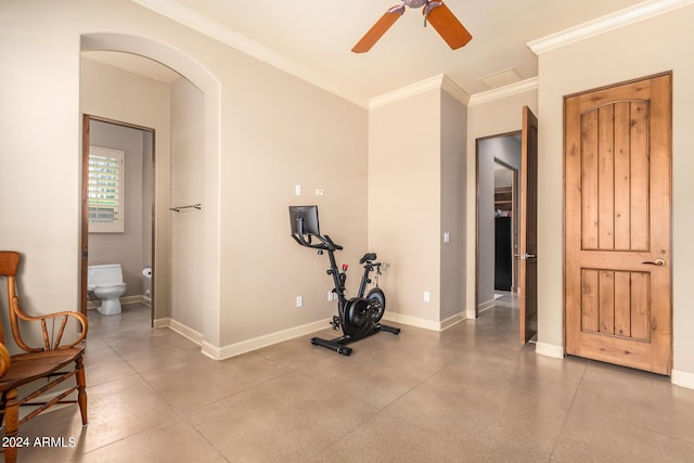 exercise room featuring crown molding and ceiling fan