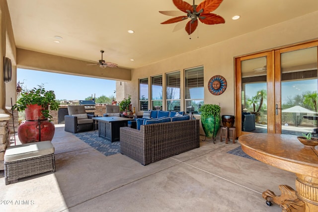 view of patio / terrace with exterior kitchen, an outdoor hangout area, and ceiling fan