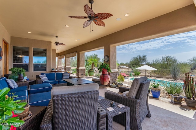 view of patio / terrace with an outdoor living space and a pool