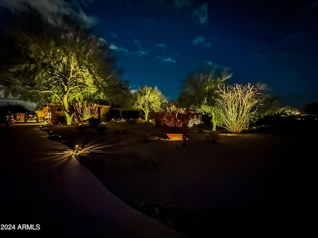 view of yard at twilight