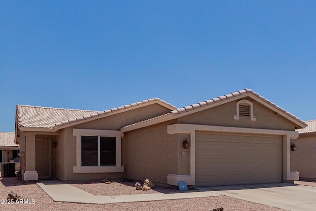 1341 E Bellerive Dr, Chandler, AZ 85249 - view of front of house featuring a garage, stucco siding, a tiled roof, and driveway