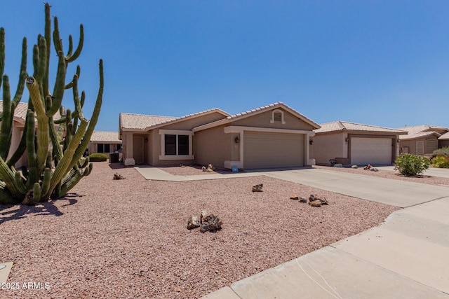 1341 E Bellerive Dr, Chandler, AZ 85249 - single story home with an attached garage, stucco siding, driveway, and a tile roof