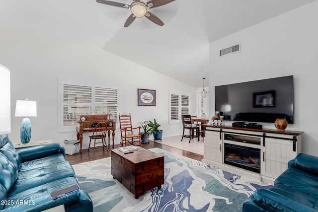 1341 E Bellerive Dr, Chandler, AZ 85249 - living room featuring ceiling fan, wood finished floors, and high vaulted ceiling