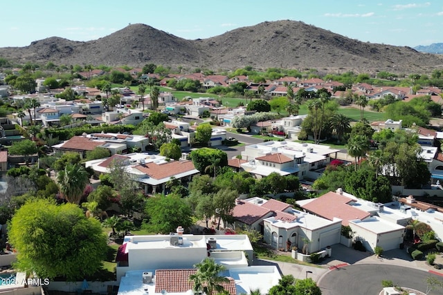 aerial view of residential area featuring a mountainous background