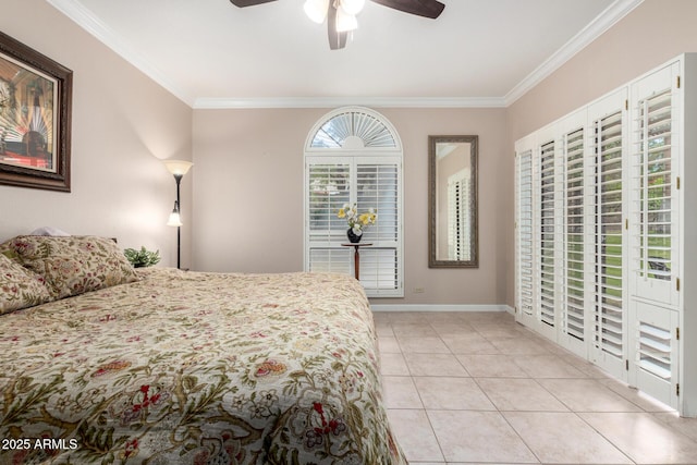 bedroom featuring crown molding, baseboards, light tile patterned floors, and ceiling fan
