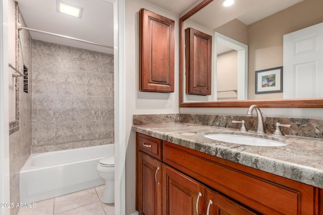 bathroom with tile patterned floors, toilet, vanity, and shower / bath combination