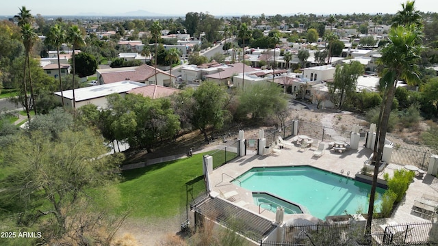 aerial perspective of suburban area featuring a pool