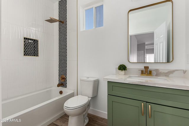 full bathroom with toilet, tiled shower / bath combo, hardwood / wood-style floors, and vanity