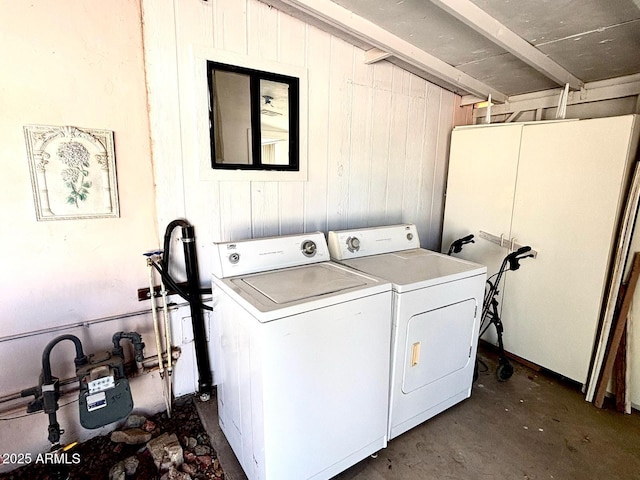 laundry room with washing machine and clothes dryer