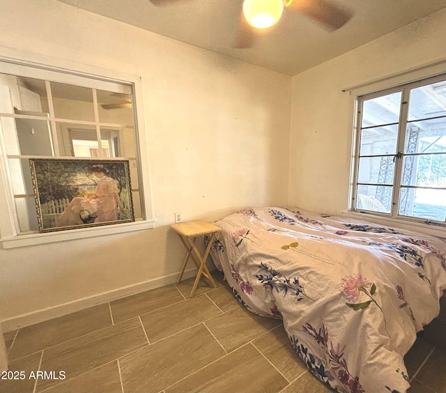 bedroom featuring wood finish floors and baseboards