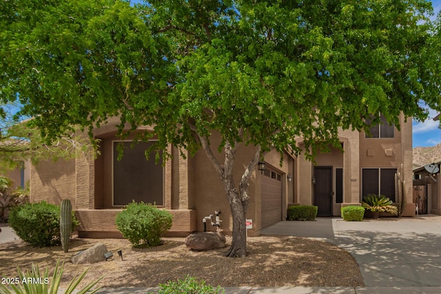 2526 W Florentine Rd, Phoenix, AZ 85086 - view of front of property with concrete driveway, a garage, and stucco siding