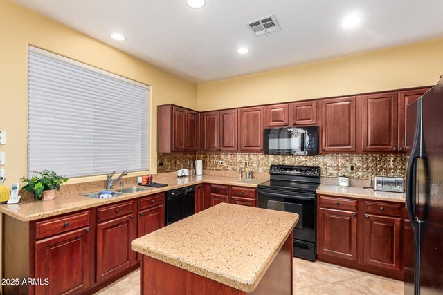 2526 W Florentine Rd, Phoenix, AZ 85086 - kitchen with black appliances, decorative backsplash, a sink, a center island, and light tile patterned floors
