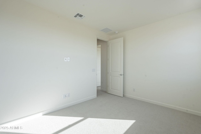 empty room with light colored carpet