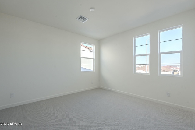 empty room featuring carpet flooring