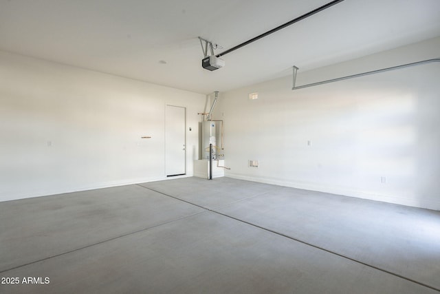 garage featuring water heater and a garage door opener