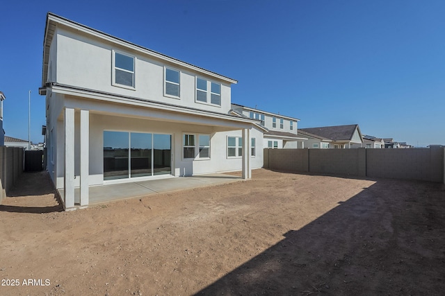 rear view of property with a patio area