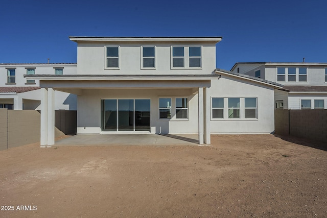 back of house featuring a patio area