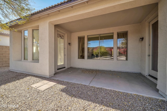 entrance to property with a patio area