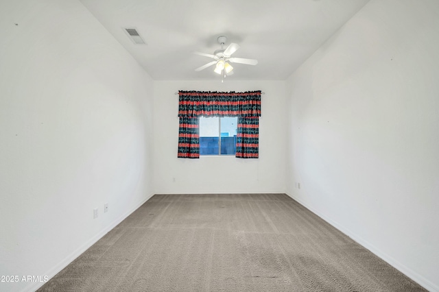 carpeted empty room featuring ceiling fan