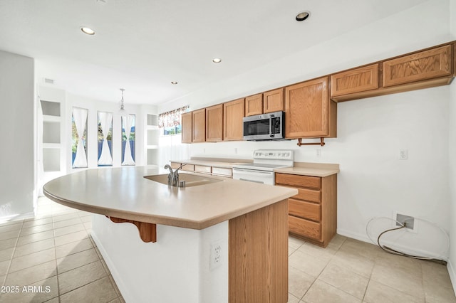 kitchen with sink, electric stove, decorative light fixtures, an island with sink, and light tile patterned flooring