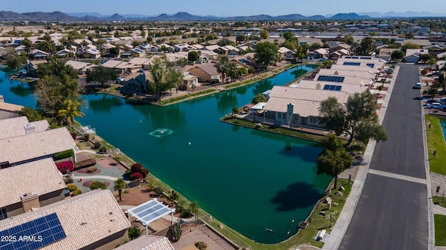 drone / aerial view with a water and mountain view