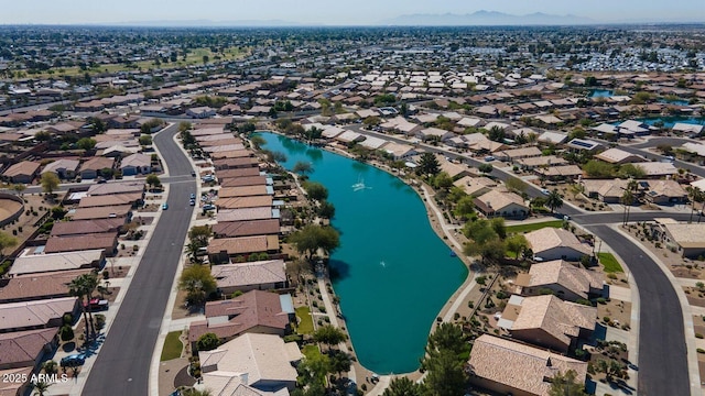 birds eye view of property featuring a water and mountain view