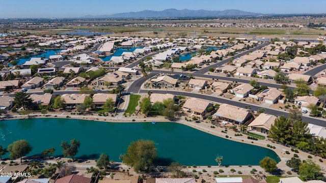 drone / aerial view with a water and mountain view