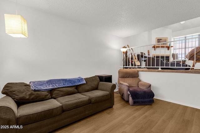 3491 N Arizona Ave Unit 118, Chandler, AZ 85225 - living area with wood finished floors and a textured ceiling