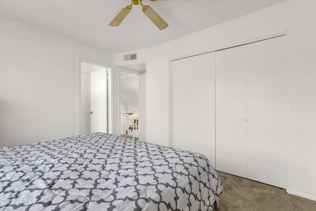 3491 N Arizona Ave Unit 118, Chandler, AZ 85225 - bedroom featuring carpet flooring, a closet, a ceiling fan, and a textured ceiling