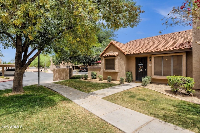 3491 N Arizona Ave Unit 118, Chandler, AZ 85225 - view of front facade featuring stucco siding, a tiled roof, and a front yard