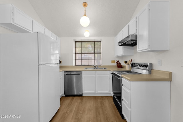 3491 N Arizona Ave Unit 118, Chandler, AZ 85225 - kitchen with freestanding refrigerator, stainless steel dishwasher, black / electric stove, under cabinet range hood, and light wood-style floors
