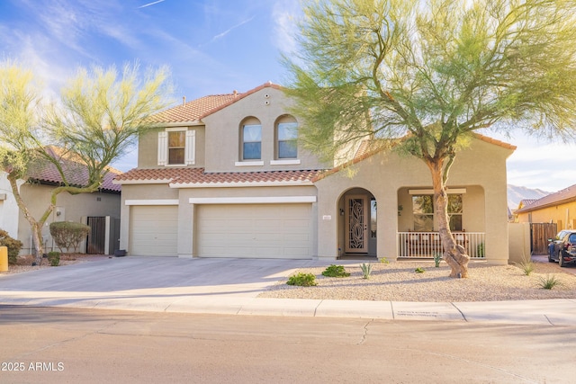 mediterranean / spanish-style home with a garage