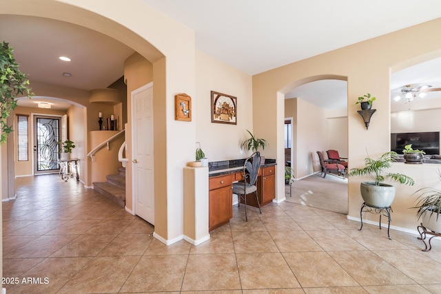 hall with light tile patterned floors