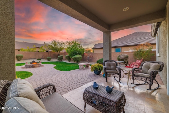 patio terrace at dusk with an outdoor living space