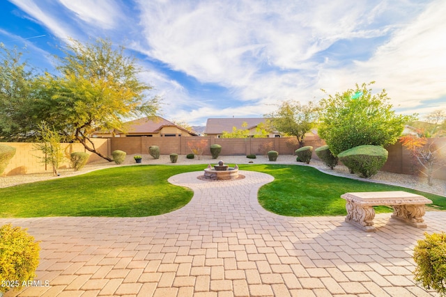 surrounding community featuring a lawn, a patio, and an outdoor fire pit