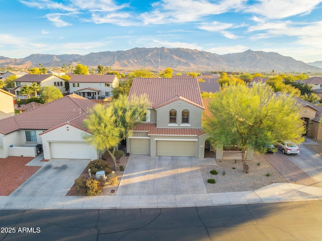 view of front of house featuring a mountain view and a garage