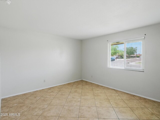 1306 W 12th St, Tempe, AZ 85281 - unfurnished room with light tile patterned flooring and baseboards