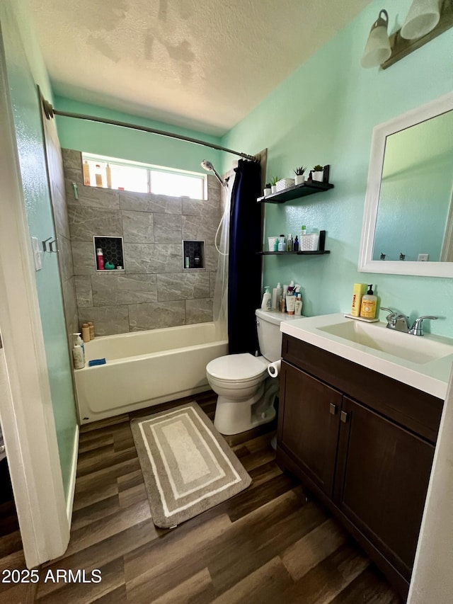 4767 W Wahalla Ln, Glendale, AZ 85308 - full bathroom with wood finished floors, vanity, shower / tub combo with curtain, and a textured ceiling