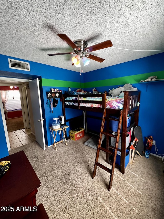 4767 W Wahalla Ln, Glendale, AZ 85308 - bedroom with a textured ceiling, carpet flooring, and a ceiling fan