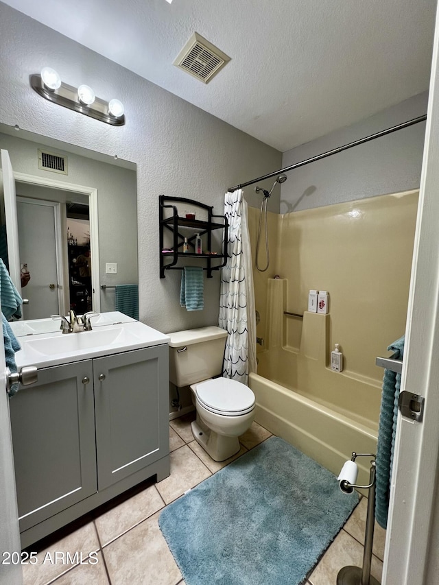 4767 W Wahalla Ln, Glendale, AZ 85308 - bathroom with a textured wall, vanity, shower / bath combo with shower curtain, tile patterned floors, and a textured ceiling