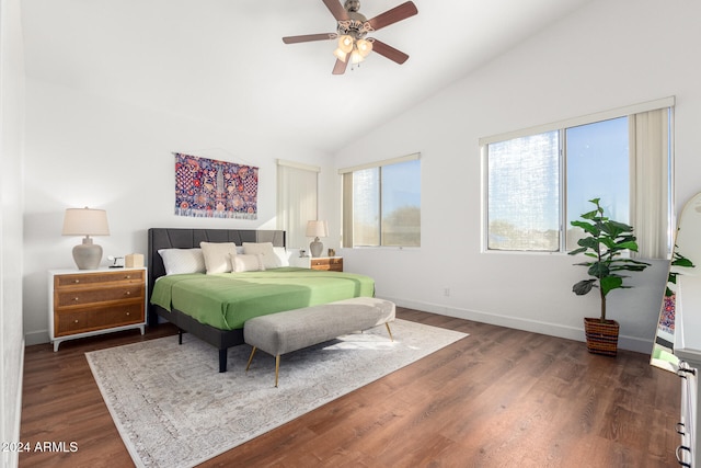 bedroom featuring dark hardwood / wood-style floors, high vaulted ceiling, and ceiling fan