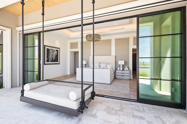 bedroom featuring an inviting chandelier and wood ceiling