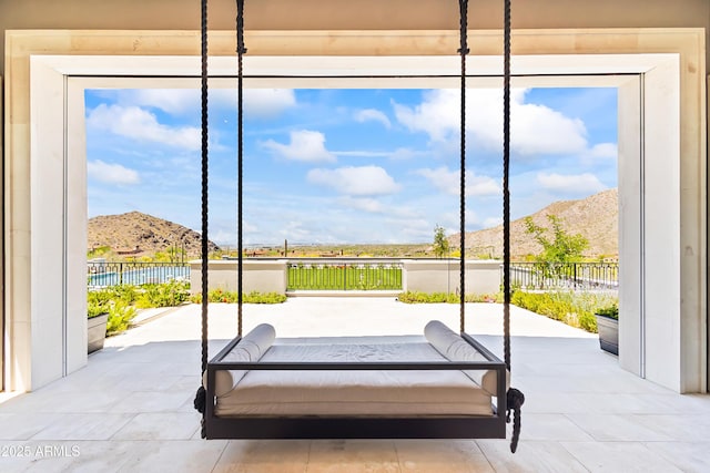 view of patio / terrace featuring a mountain view