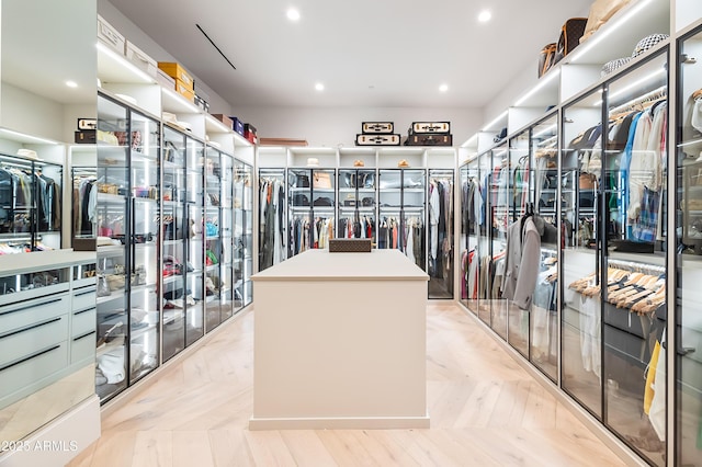 spacious closet featuring light parquet floors